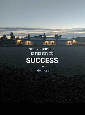 Motivational Quote on Empty School Grounds at Dusk with Self Discipline Theme HD phone wallpaper