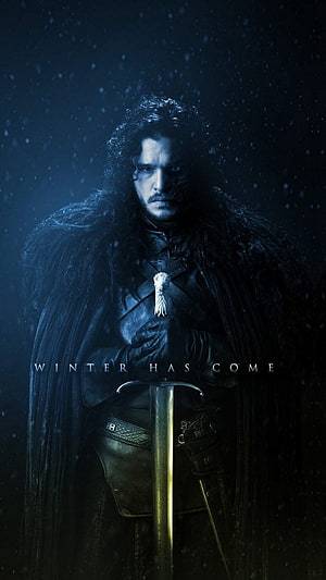 Jon Snow from Game of Thrones holding a sword in a dark winter storm HD phone wallpaper