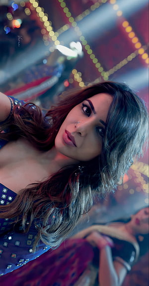 Samantha in Pushpa film still with dramatic stage lighting and bokeh background HD phone wallpaper