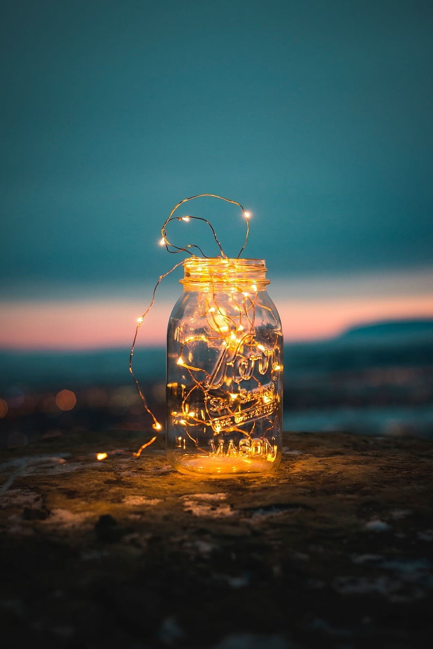 Glowing Fairy Lights Inside A Mason Jar Against A Dusk Skyline HD phone wallpaper