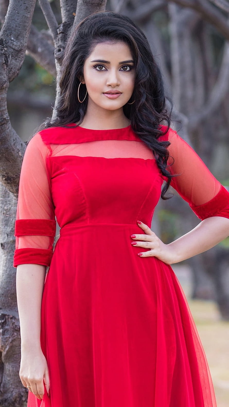 Anupama Parameswaran in a vibrant red dress with sheer sleeves and gold hoop earrings HD phone wallpaper