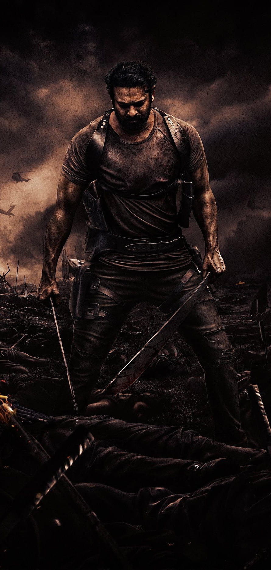 Prabhas as Saaho in Salaar: A Warrior Standing Over a Battlefield of Fallen Soldiers HD phone wallpaper