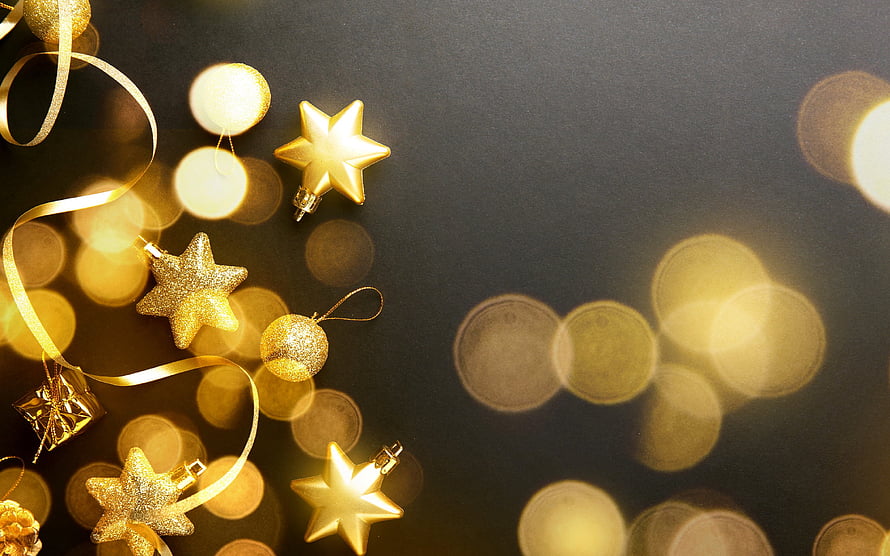 Elegant Gold Star Ornaments and Ribbons on Dark Background with Warm Bokeh Lights HD wallpaper