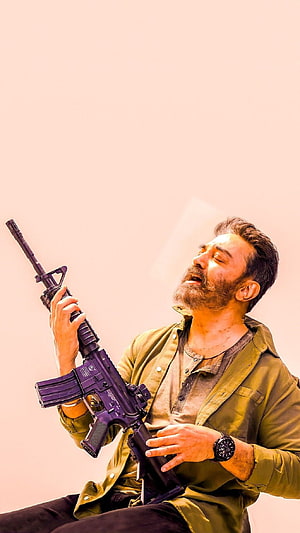 Vikram Tamil Movie Character Holding Purple Rifle in Olive Jacket HD phone wallpaper