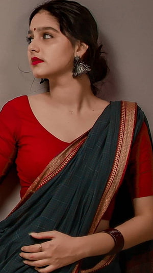 Anaswara Rajan in a red blouse and teal silk saree with gold border HD phone wallpaper