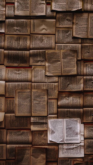 Vintage Open Books Wall Texture with Aged Paper and Dense Text HD phone wallpaper