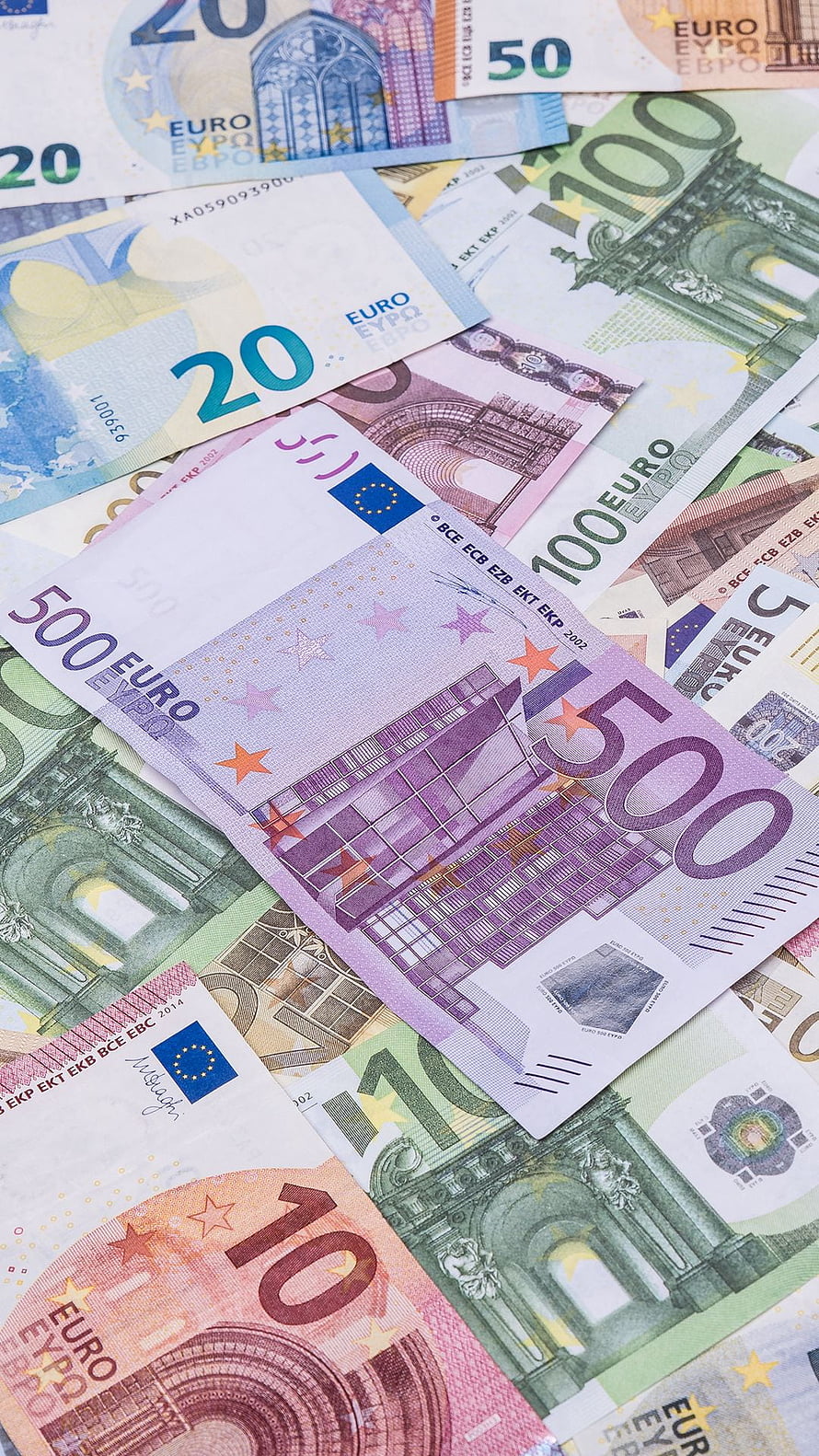 Scattered Euro Banknotes in Various Denominations Including 500, 100, 50, 20, 10, and 5 Euro Bills HD phone wallpaper