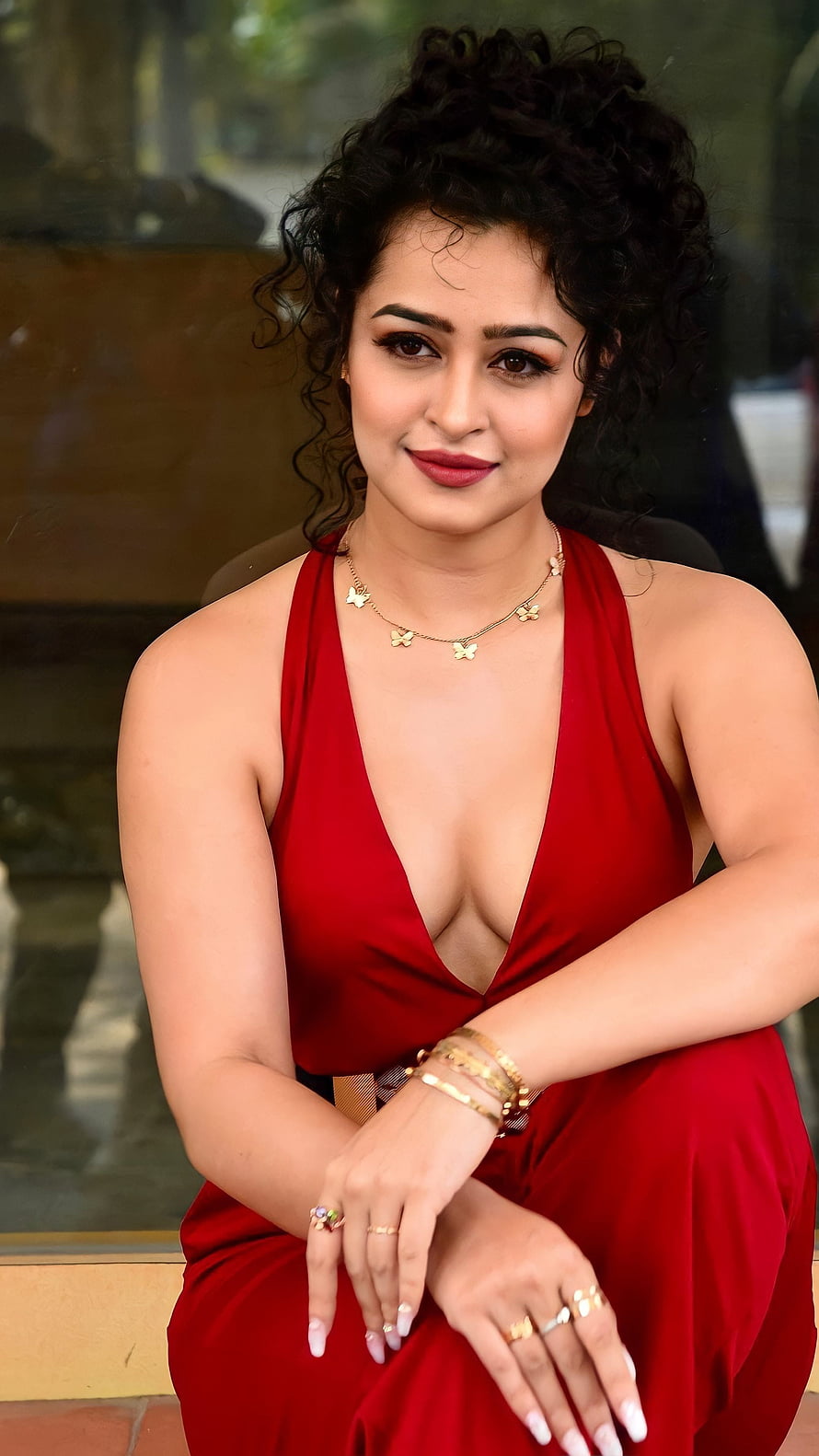 Apsara Rani in a Deep Red Halter Gown with Gold Butterfly Necklace and Bracelets HD phone wallpaper