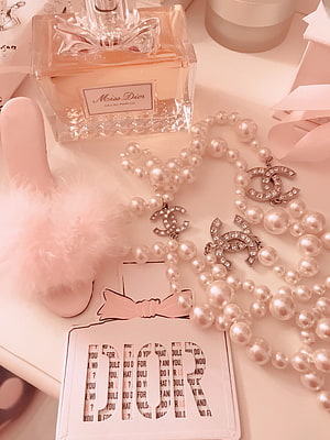Pink Aesthetic Flat Lay with Miss Dior Perfume, Pearl Necklace, and Chanel Charms HD phone wallpaper