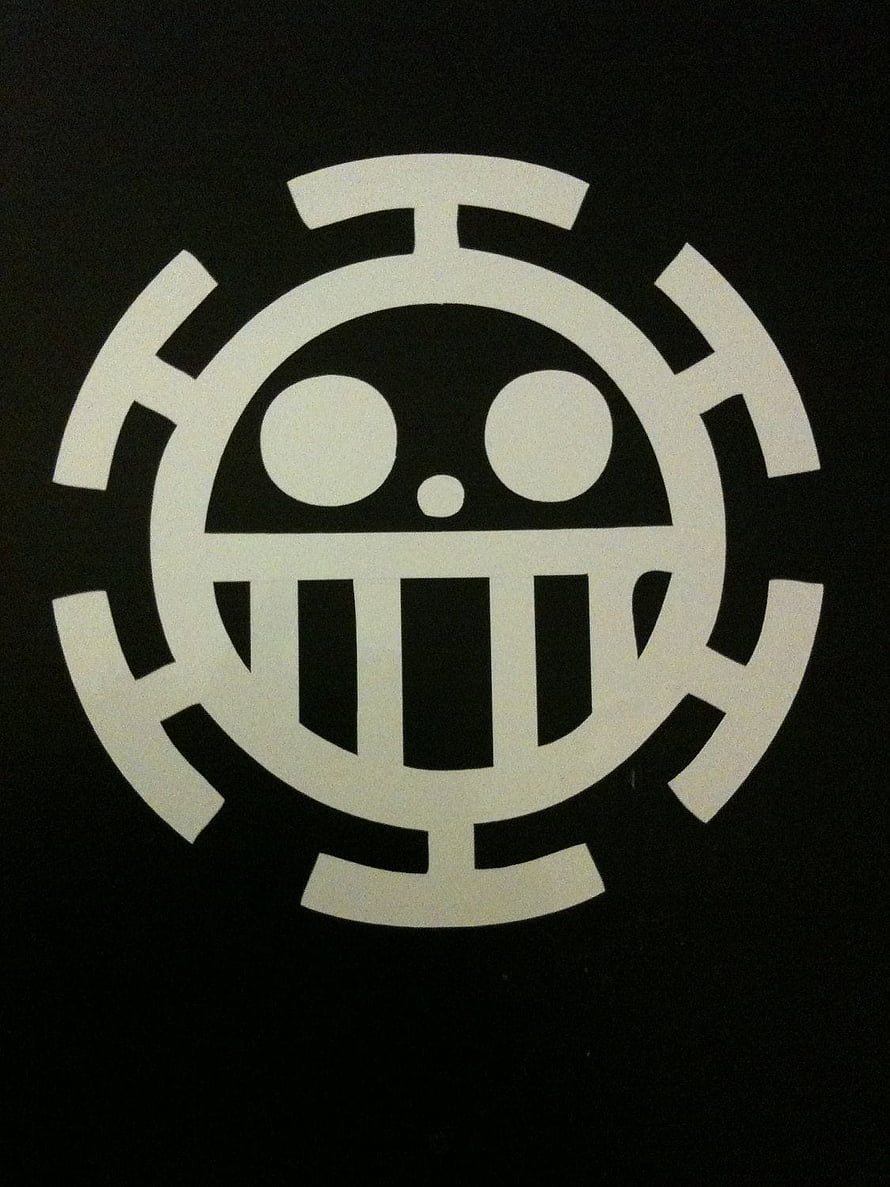 One Piece Heart Pirates Jolly Roger Emblem on Black Background HD phone wallpaper