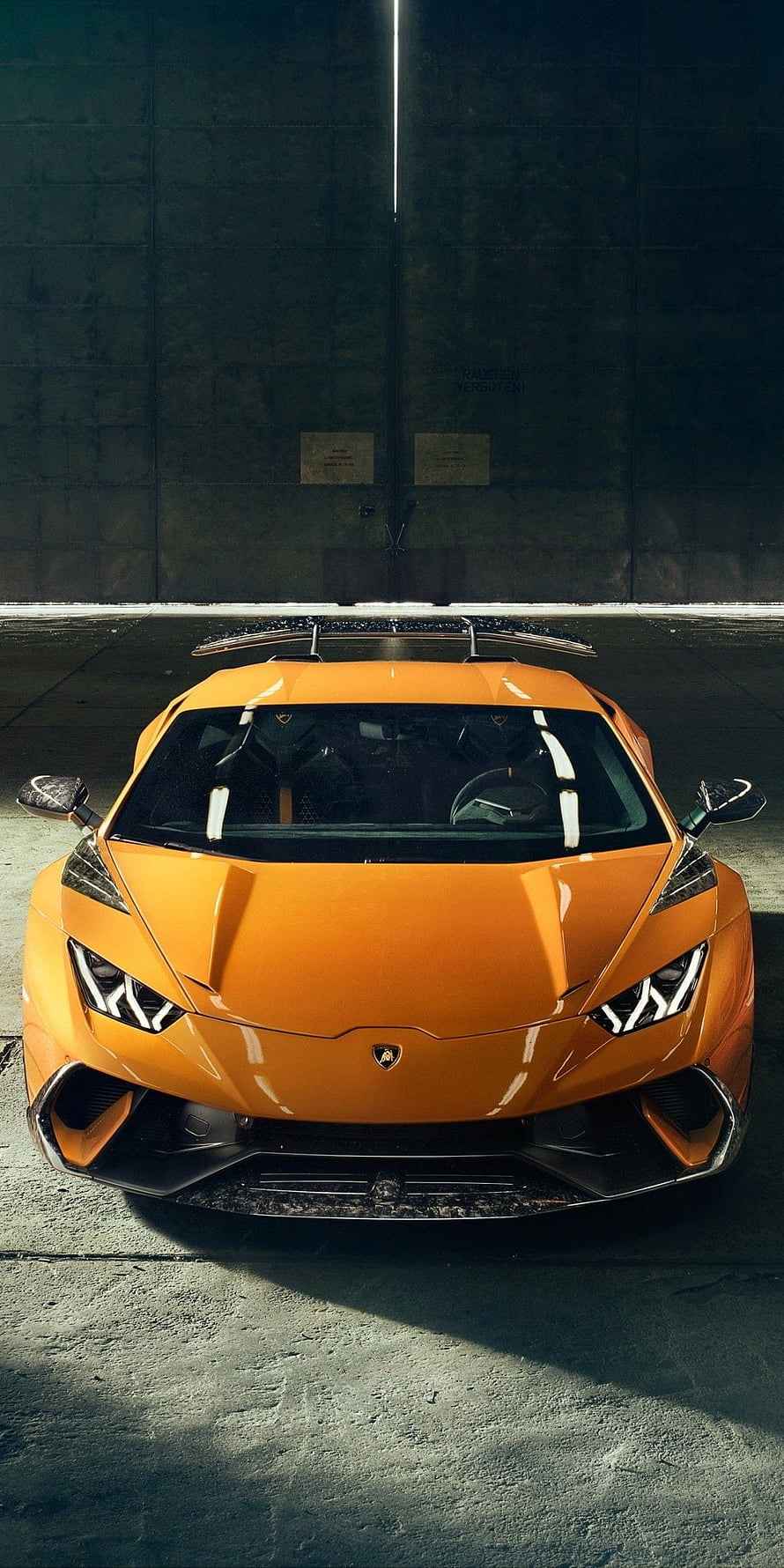 Orange Lamborghini Huracan Front View in Dark Underground Parking Garage HD phone wallpaper
