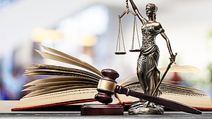 Lady Justice Statue with Scales and Sword on Open Law Book with Gavel HD wallpaper
