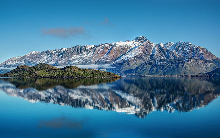 Snow-Capped Mountain Range Reflected in a Calm Lake in New Zealand HD wallpaper