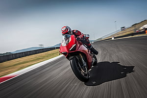 Ducati Panigale V4 Spedale Racing Motorcycle Cornering on a Track HD wallpaper