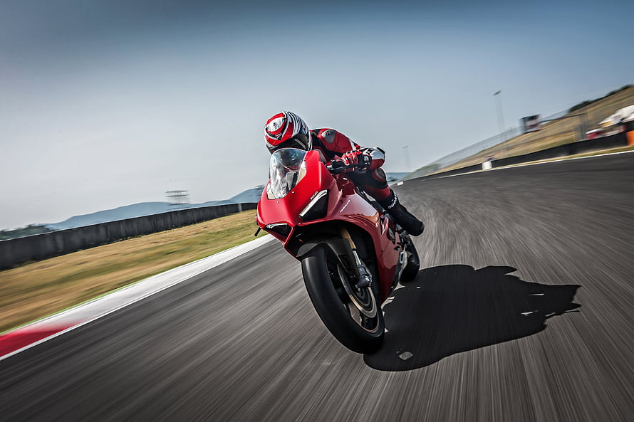 Ducati Panigale V4 Spedale Racing Motorcycle Cornering on a Track HD wallpaper