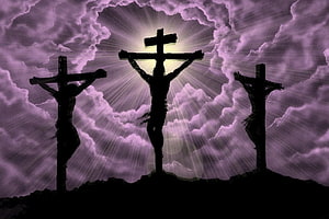 Three Crosses Silhouetted Against Dramatic Purple Sky With Divine Light Rays HD wallpaper