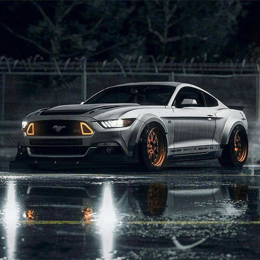 Silver Ford Mustang GT RTR with orange wheels parked on wet asphalt at night HD phone wallpaper