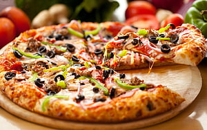 Supreme Pizza With Black Olives, Peppers, and Melted Cheese on a Wooden Board HD wallpaper