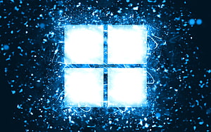 Glowing Microsoft Windows 11 Logo With Electric Blue Particle Effects HD wallpaper