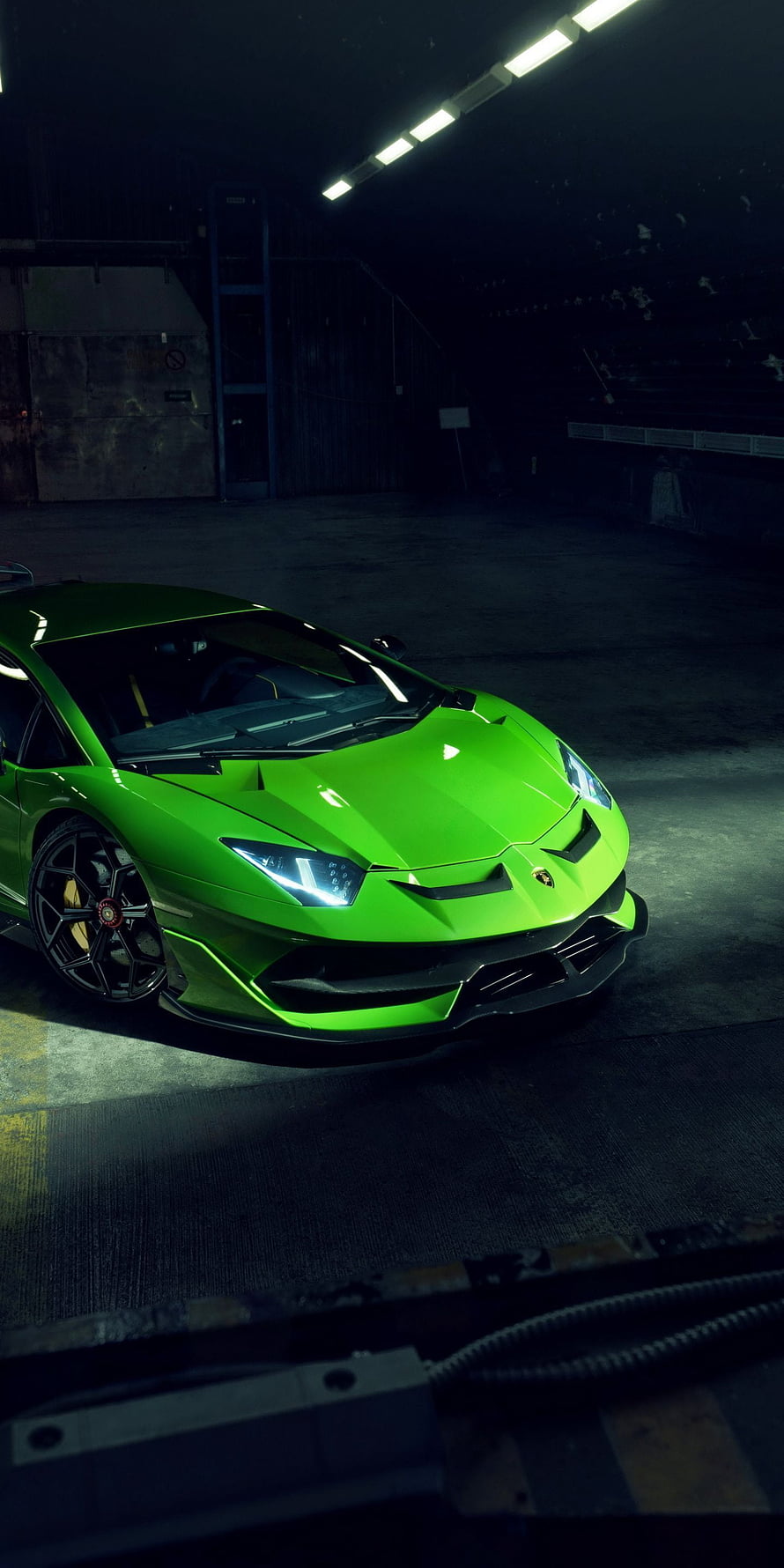Vibrant Green Lamborghini Aventador SVJ Parked in a Dark Industrial Garage HD phone wallpaper