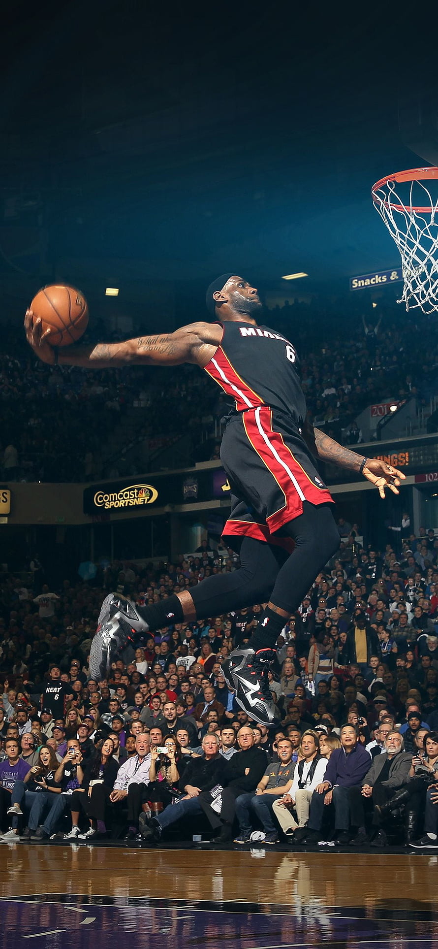 LeBron James in Miami Heat jersey executing a powerful dunk during an NBA game HD phone wallpaper