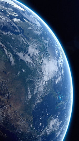 Planet Earth Viewed From Space With Glowing Atmosphere And Swirling Clouds HD phone wallpaper