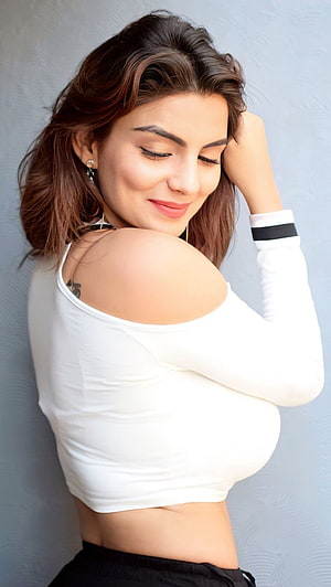 Anveshi Jain in a White Off-Shoulder Crop Top with Black Bottoms HD phone wallpaper
