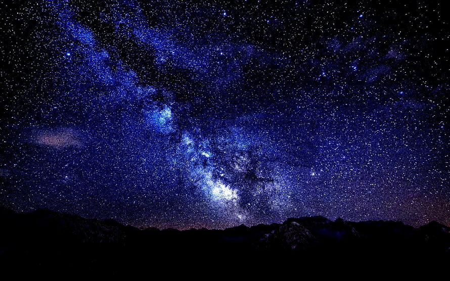 Milky Way Galaxy Arching Over Dark Mountain Silhouette at Night HD wallpaper