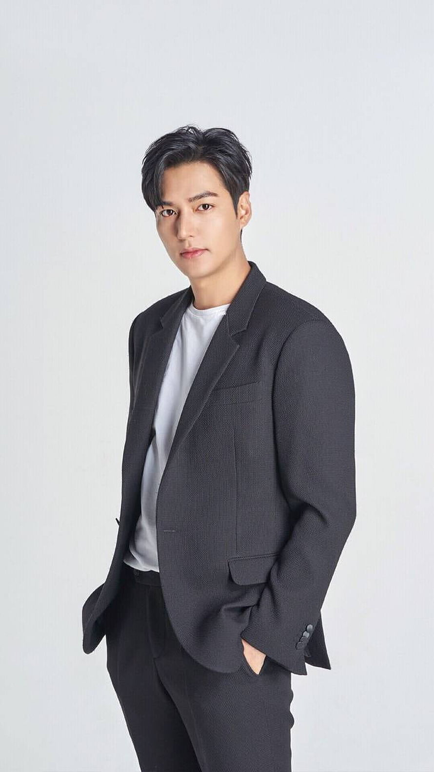 Lee Min Ho in a dark tailored blazer and white t-shirt against a clean studio backdrop HD phone wallpaper