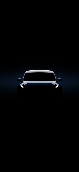 Tesla Model Y Front View in Dark Minimalist Setting with Glowing Headlights HD phone wallpaper