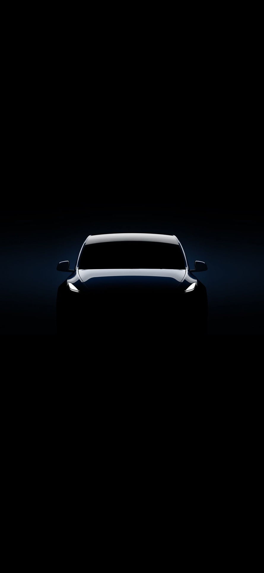 Tesla Model Y Front View in Dark Minimalist Setting with Glowing Headlights HD phone wallpaper