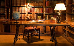 Vintage Study Room With Antique Desk, Leather Books, And Warm Lamp Light HD wallpaper