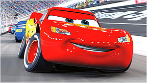 Lightning McQueen Racing on the Track in Cars Animated Movie Scene HD wallpaper