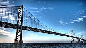 Mackinac Bridge Suspension Span Over Water Under Blue Sky HD wallpaper