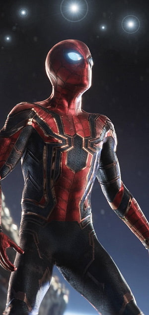 Spider-Man in Iron Spider Armor with Glowing Eyes Against a Dark Starry Sky HD phone wallpaper