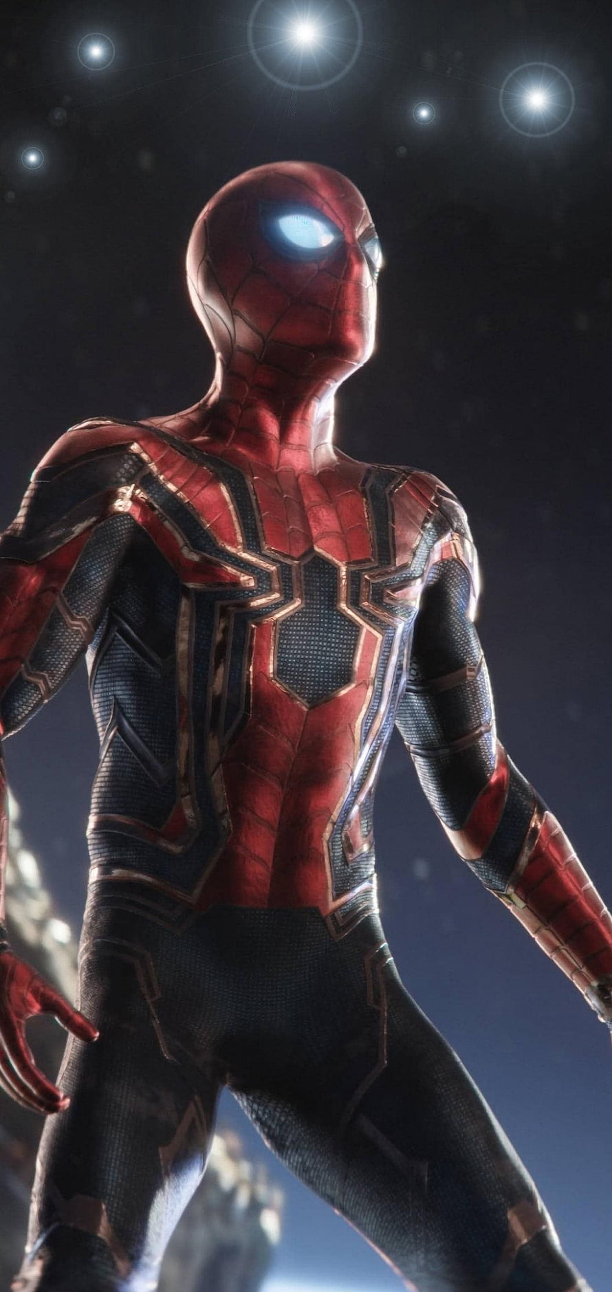 Spider-Man in Iron Spider Armor with Glowing Eyes Against a Dark Starry Sky HD phone wallpaper