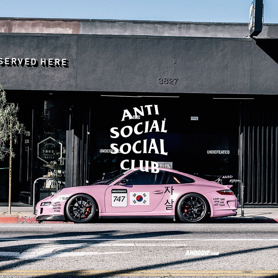 Pink Porsche 911 with Anti Social Social Club Livery Parked on Urban Street HD wallpaper