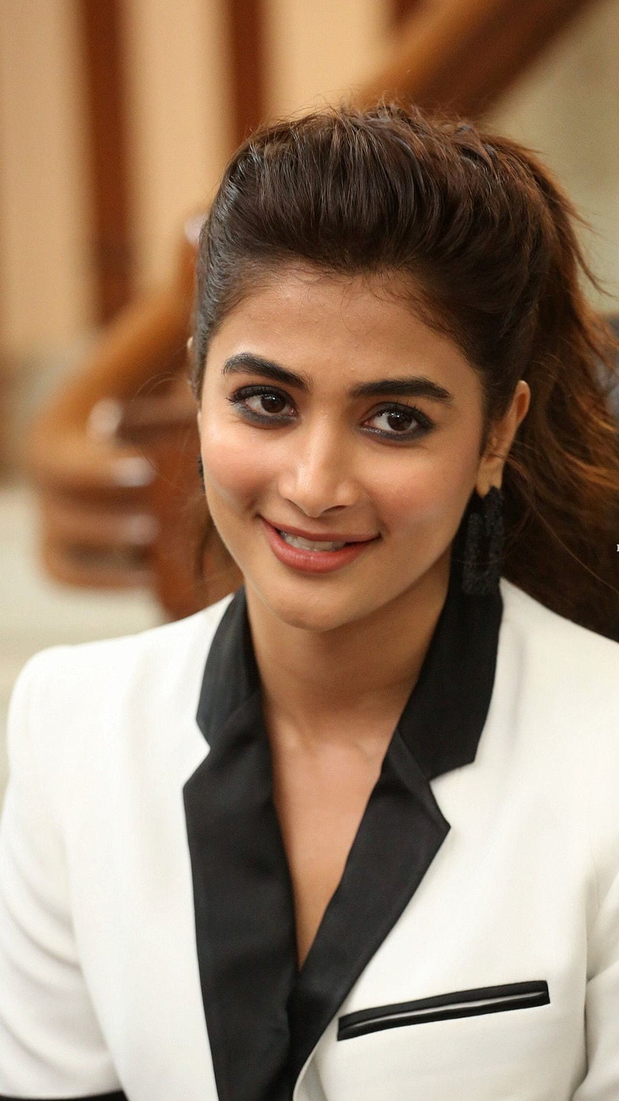 Pooja Hegde in a White Blazer with Black Lapels and Updo Hairstyle HD phone wallpaper