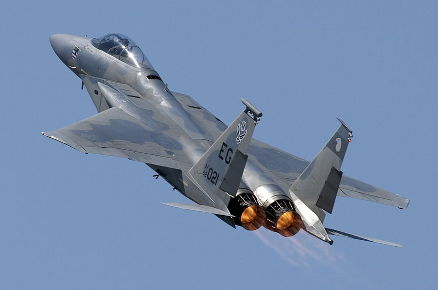 F-15 Eagle Fighter Jet Banking Through Clear Blue Sky With Afterburners Lit HD wallpaper