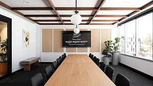 Modern Conference Room With Long Oak Table, Black Chairs, and Wall-Mounted Display HD wallpaper