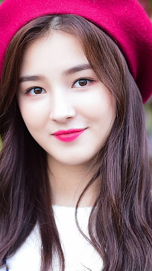 Nancy from Momoland in a vibrant pink beret with long wavy hair and bright pink lipstick HD phone wallpaper
