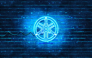 Yamaha Tuning Fork Neon Sign Glowing on Dark Blue Brick Wall HD wallpaper