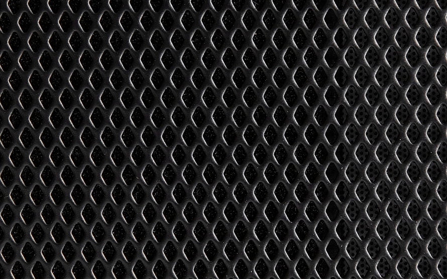 Close-up of black metal rhombic grid texture with repeating diamond pattern and industrial surface detail HD wallpaper