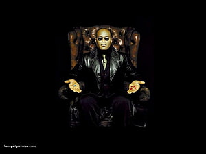 Morpheus Seated on a Leather Throne Holding the Red and Blue Pills from The Matrix HD wallpaper