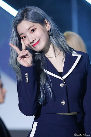Dahyun from TWICE in a navy blue suit with silver hair and a peace sign HD phone wallpaper