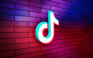 TikTok 3D Logo on Vibrant Gradient Brick Wall with Neon Lighting Effects HD wallpaper