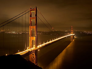 Golden Gate Bridge Illuminated at Night Over San Francisco Bay HD wallpaper
