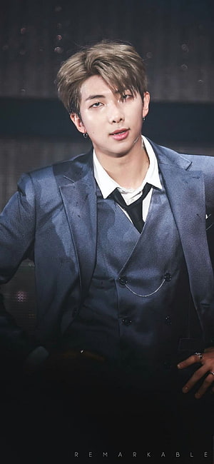 Kim Nam Joon in a Textured Navy Blue Suit with White Shirt and Black Tie HD phone wallpaper