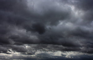 Dramatic Dark Storm Clouds Filling the Overcast Sky HD wallpaper